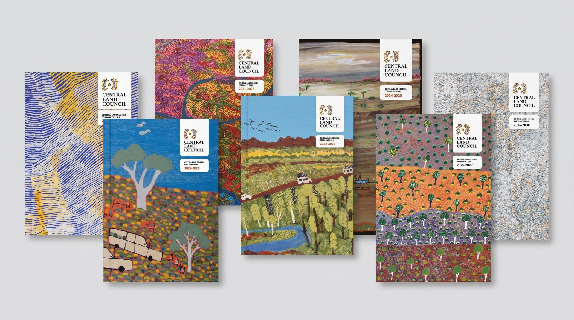 Four colorful abstract landscape art books displayed on a gray background.