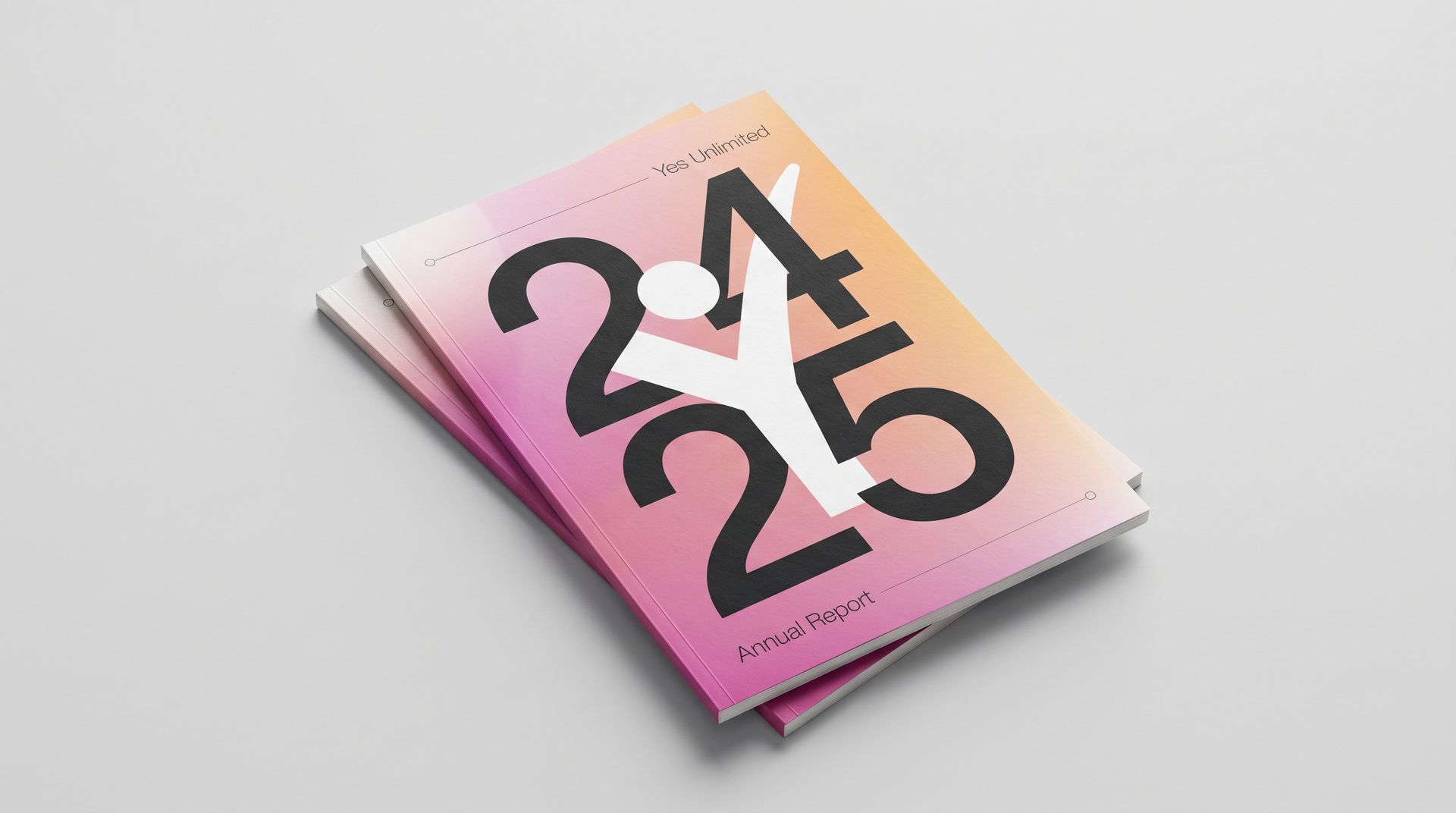 Two orange notebooks with abstract black-and-white cover designs on a gray background