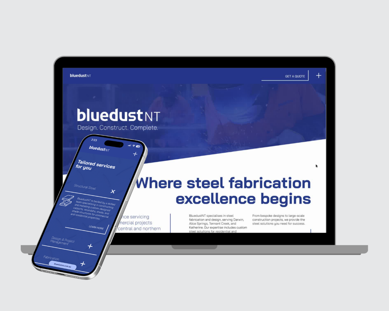 Laptop and smartphone displaying a blue steel fabrication website on a white background
