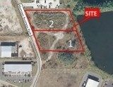 Aerial view of a site map with two red outlined lots labeled 1 and 2, beside buildings and trees.