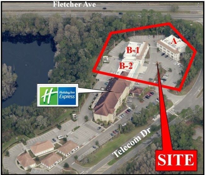Aerial site map of a hotel complex outlined in red with labeled buildings B-1, B-2, A and a red SITE arrow.