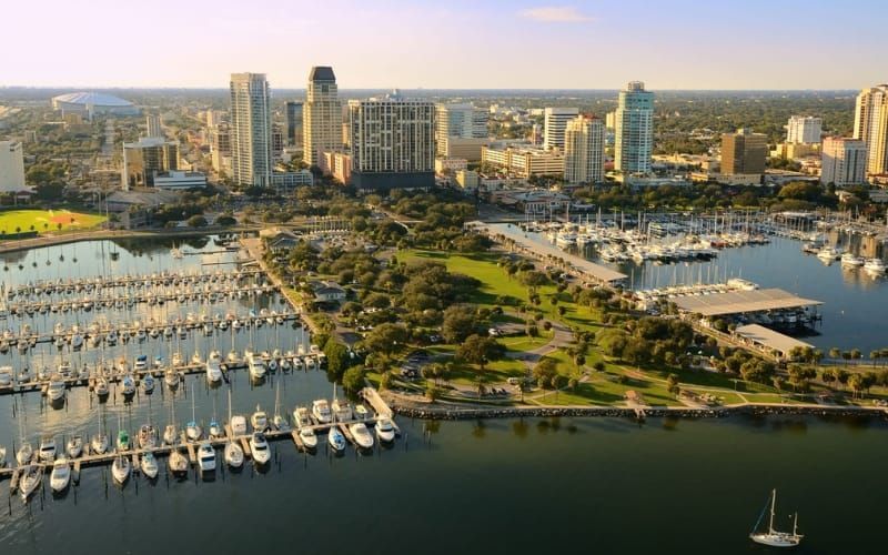 St. Petersburg, Florida skyline with marina, boats, and park on a sunny day.