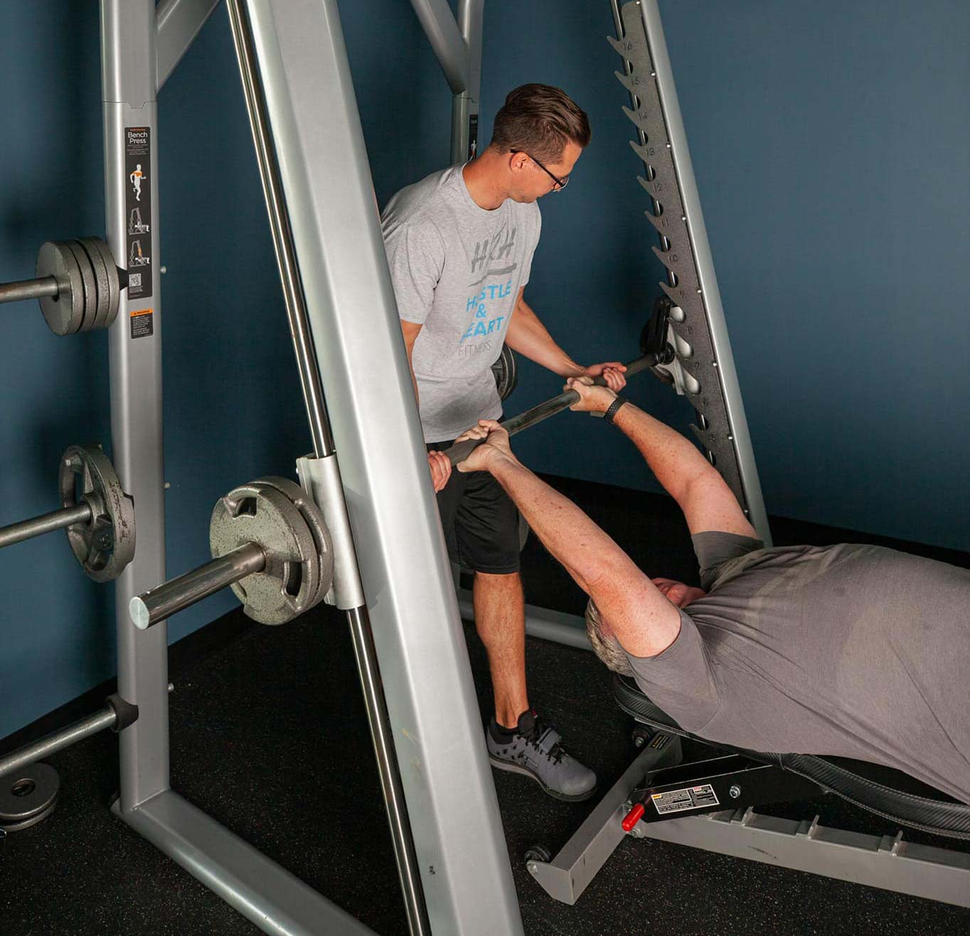 Man Lifting a Barbell — Overland Park, KS — Hustle and Heart Fitness
