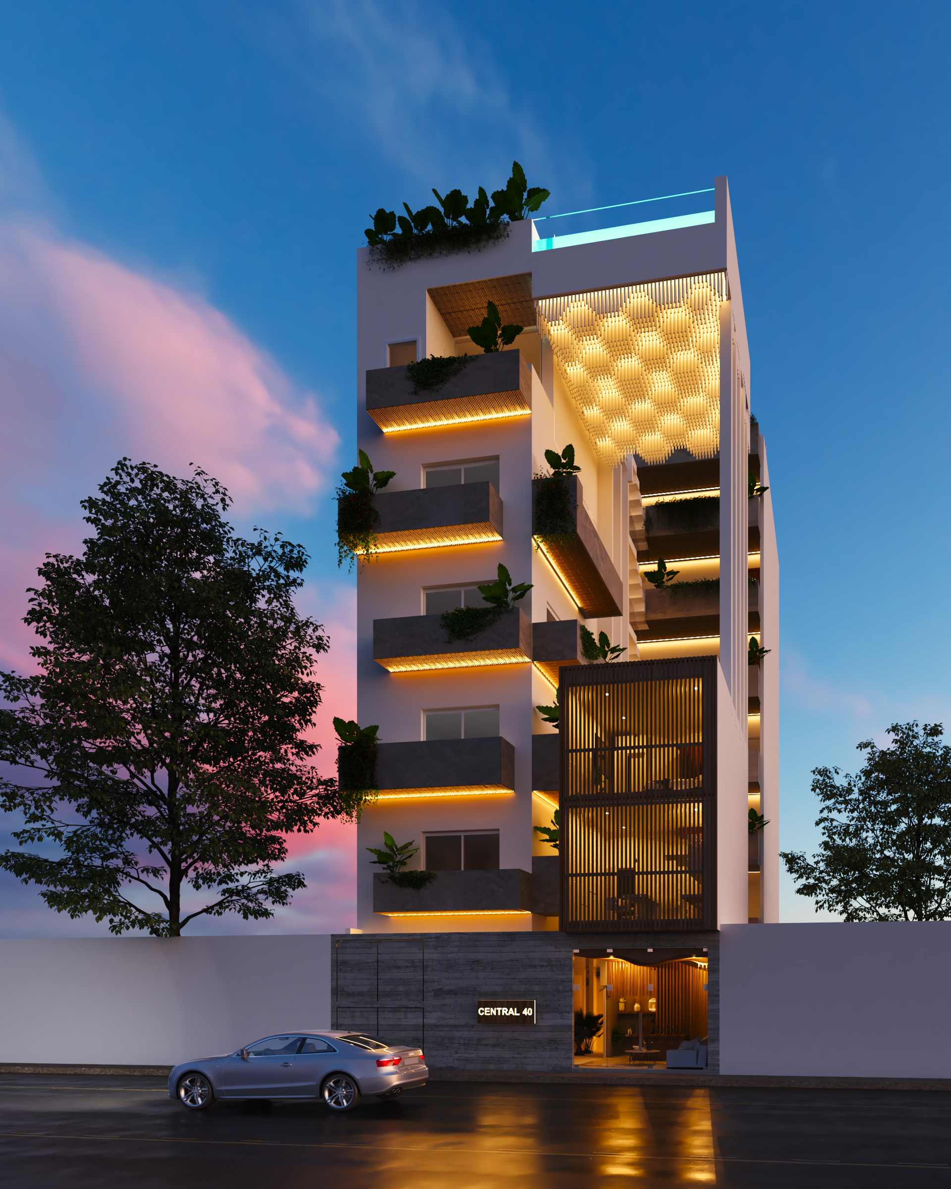 Modern white building with balconies and greenery at dusk, car parked out front.