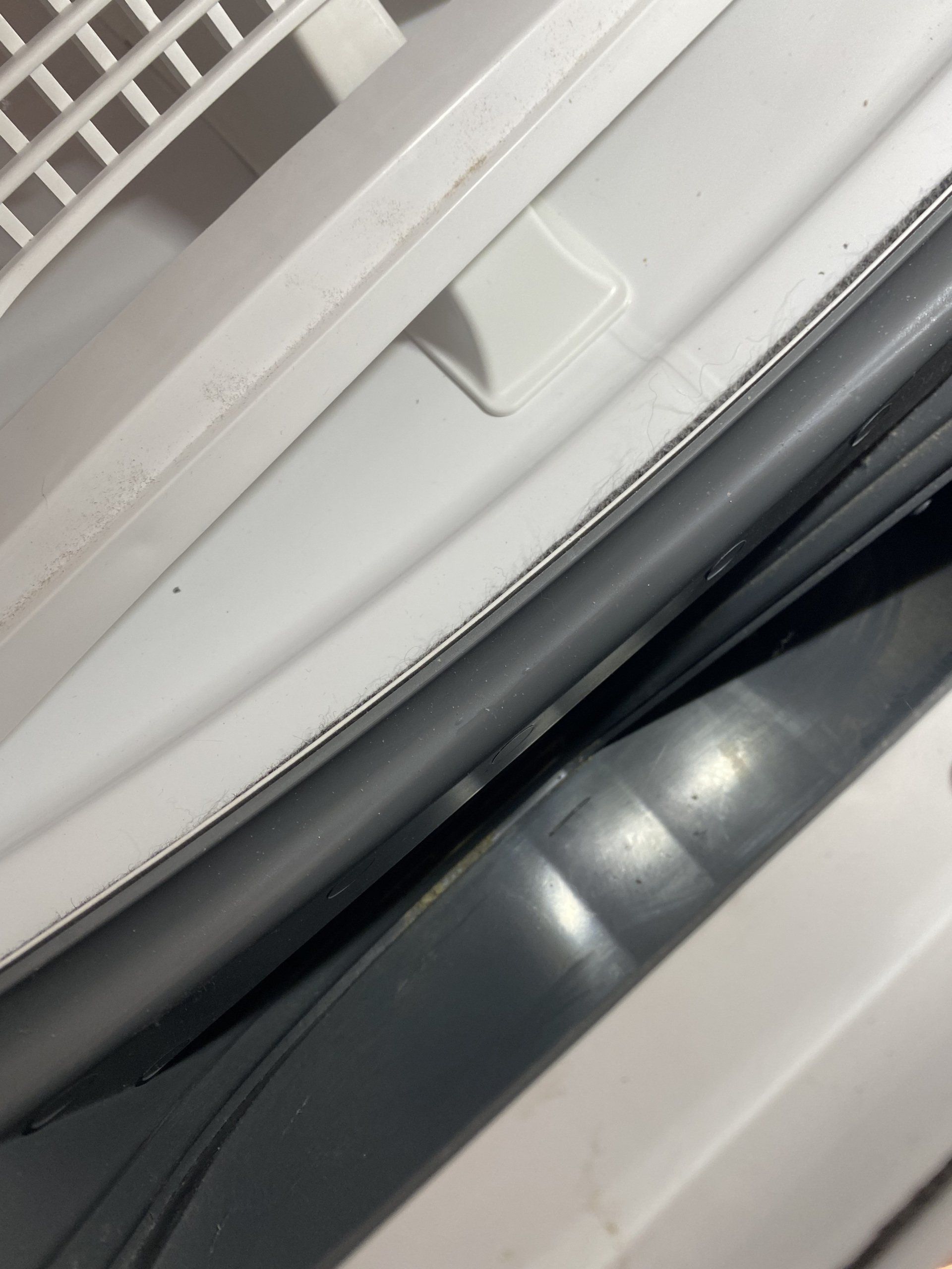 A close up of the inside of a washing machine.