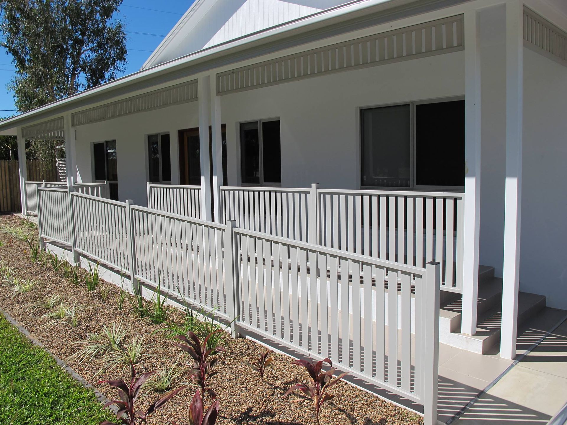 White Building With a Ramp and Railing. a Barrier-free Entrance — Lifestyle Aluminium Lattice in Annandale, QLD