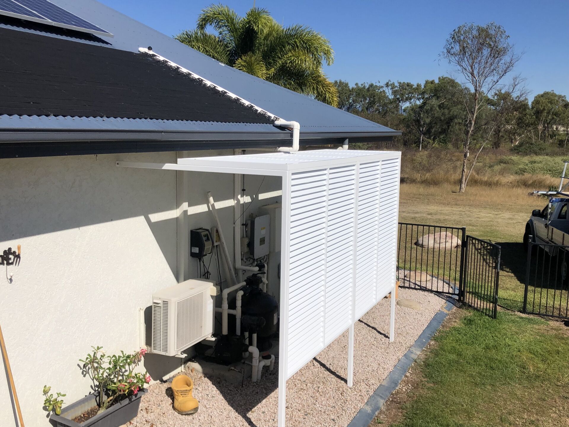 White Screened Enclosure Next to a House — Lifestyle Aluminium Lattice in West End, QLD