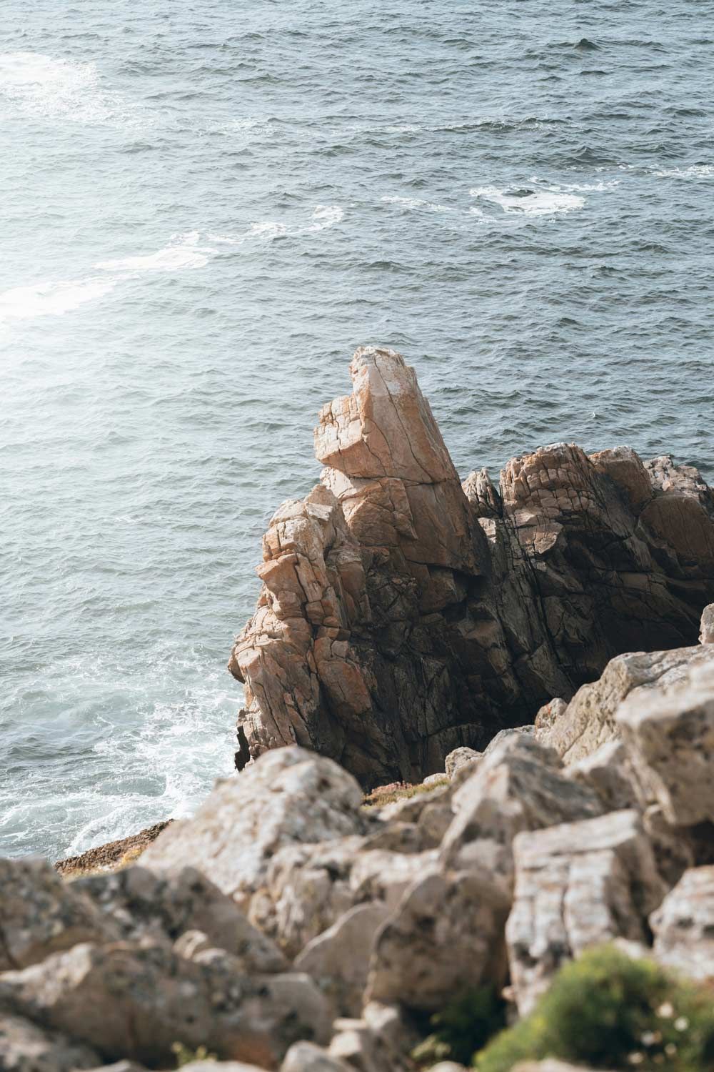 Seaside with jagged rocks and soft waves
