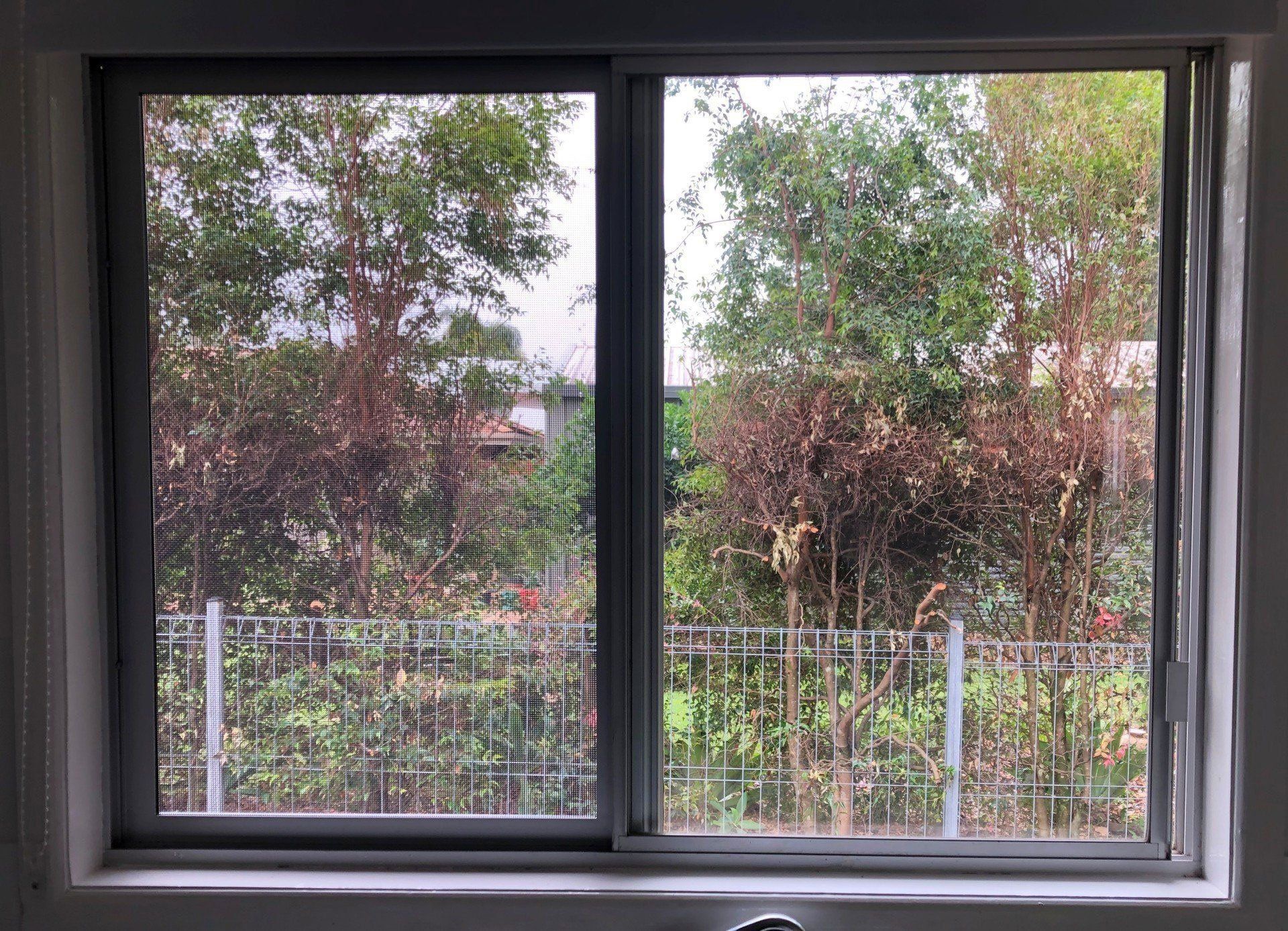 Before & After images of window with diamond grille security screen before and secureview stainless steel security screen after