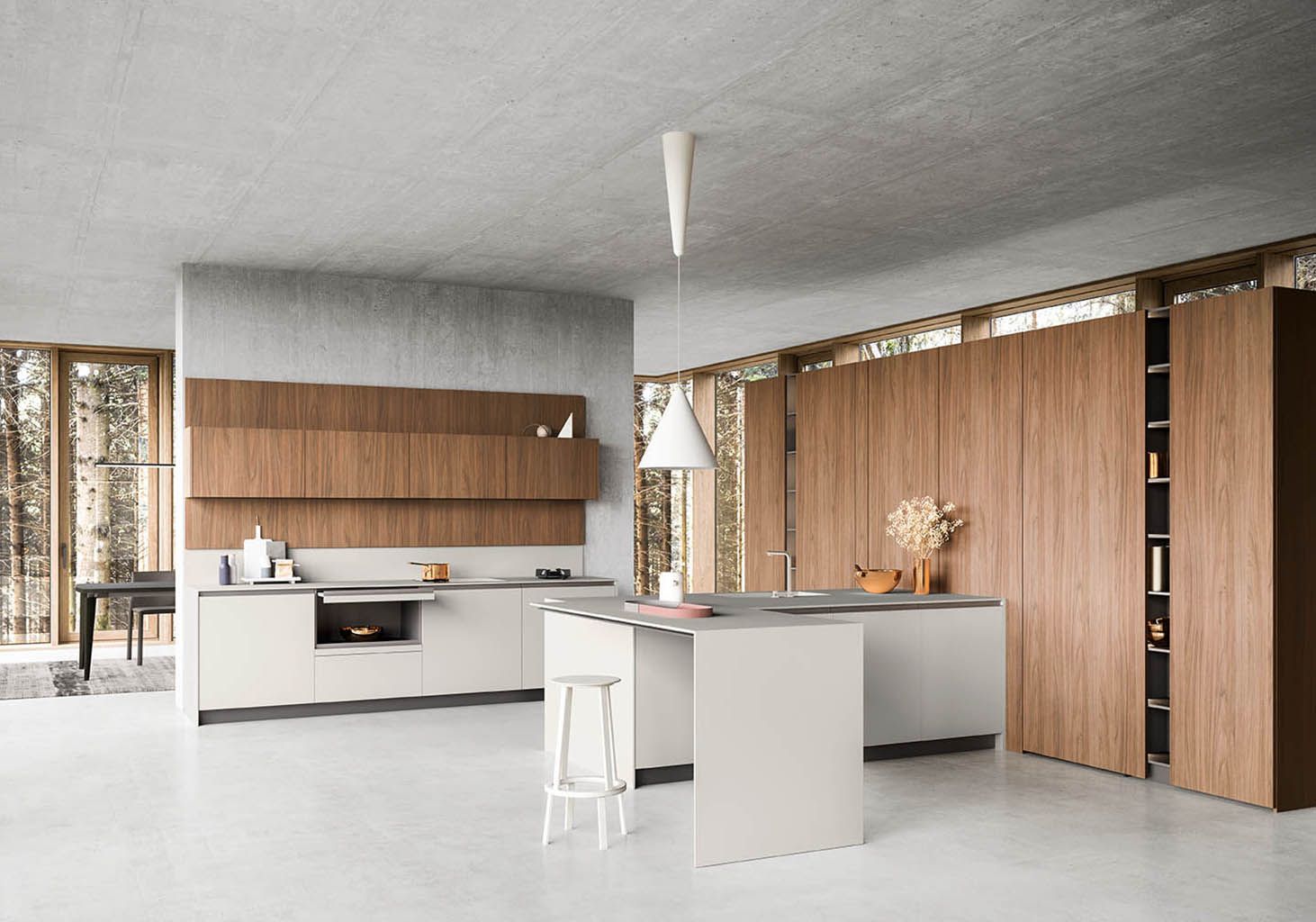 Cucina moderna con mobili in legno e bianchi, isola e pareti strutturate.