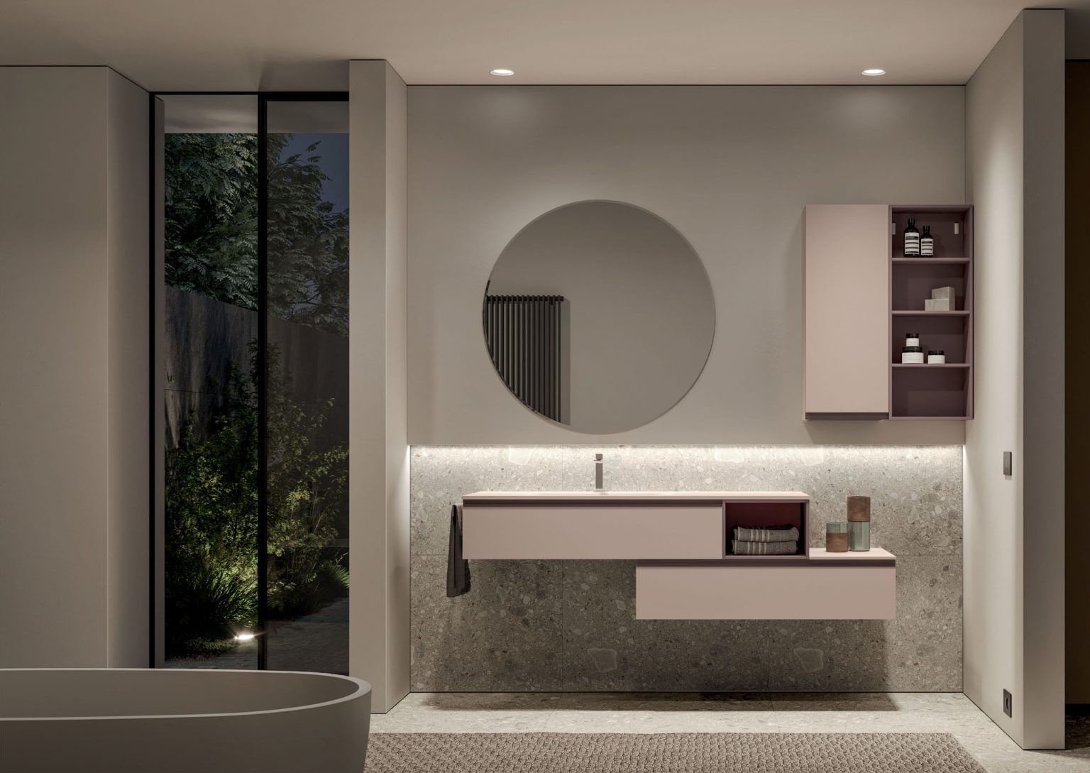 Bagno moderno con mobile lavabo sospeso, specchio rotondo e illuminazione da incasso, colori neutri.