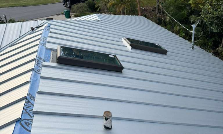 Metal roof with two skylights.