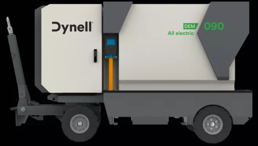 Un camion blanc et gris avec le mot dynell sur le côté.