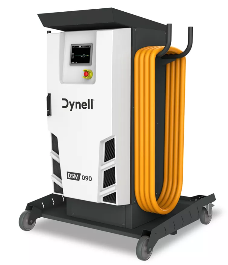 Une machine Dynell avec un tuyau jaune attaché