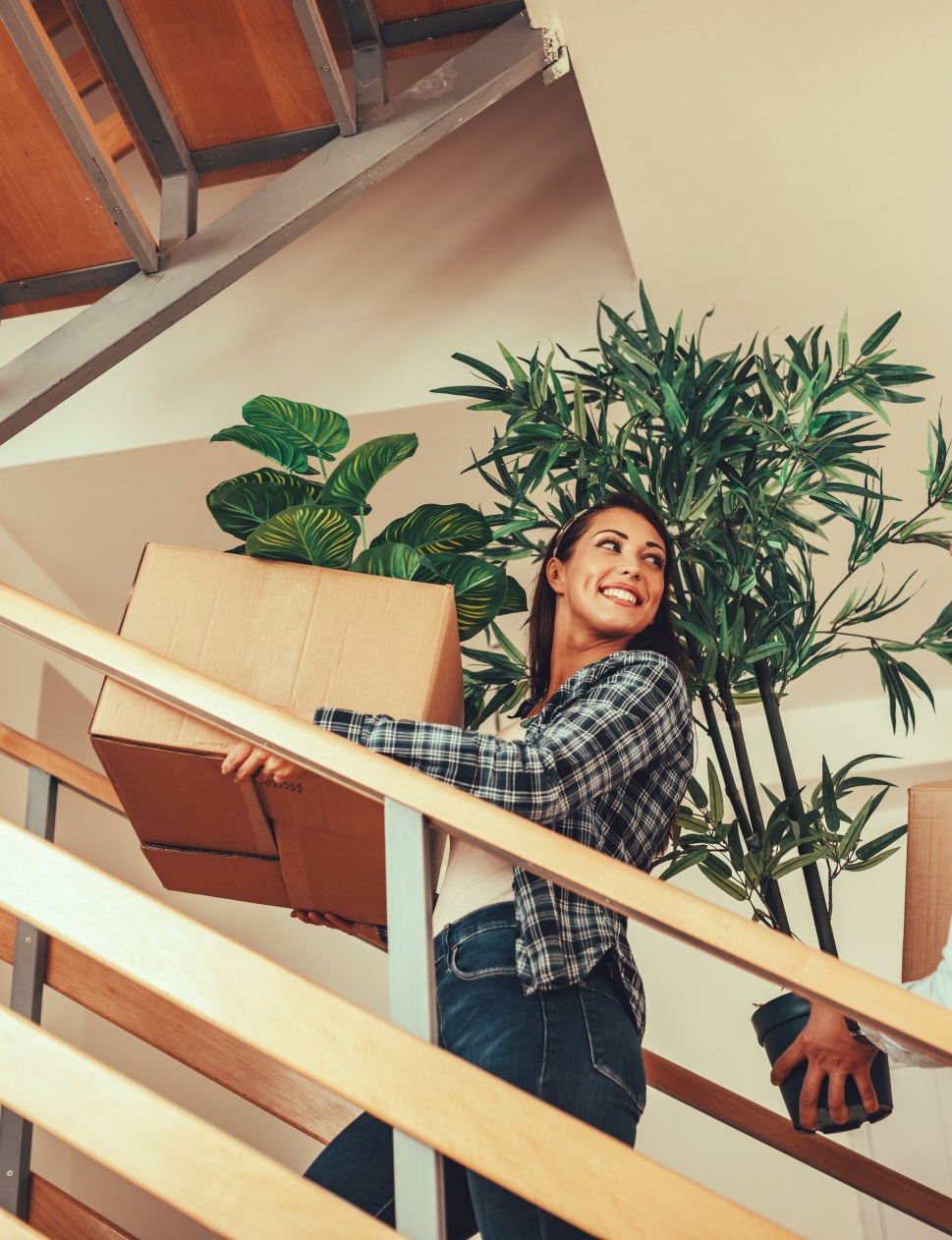 a family moving boxes into their new house
