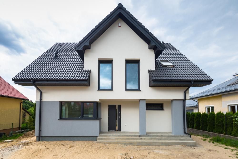 A White House With A Black Roof And A Lot Of Windows — Strait Edge Painting In Gold Coast, NSW