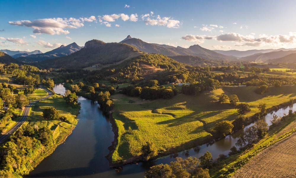An Aerial View Of A River Surrounded By Mountains And Trees — Strait Edge Painting In Tweed Heads, NSW