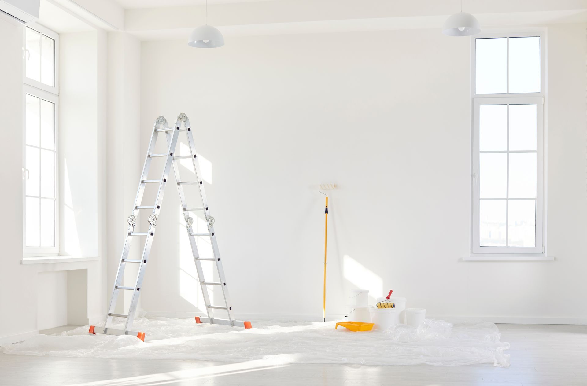 A Stepladder, a Paint Roller, and Paint Supplies Sitting on a Drop Cloth — Strait Edge Painting In Tweed Heads South, NSW