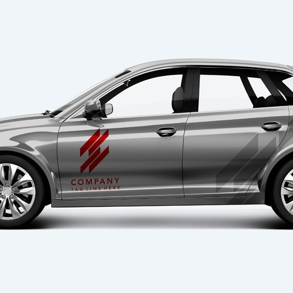 Silver company SUV with red logo decal on the side, shown in profile on a light background