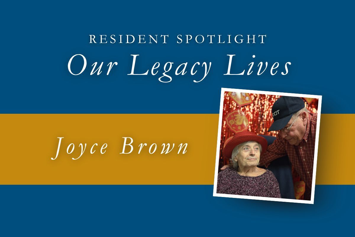 Resident Spotlight: Joyce Brown. Elderly couple, one wearing hat, pose near gold and blue banner.
