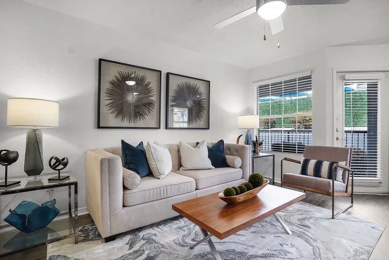 Living room with a sofa, coffee table, and chair.
