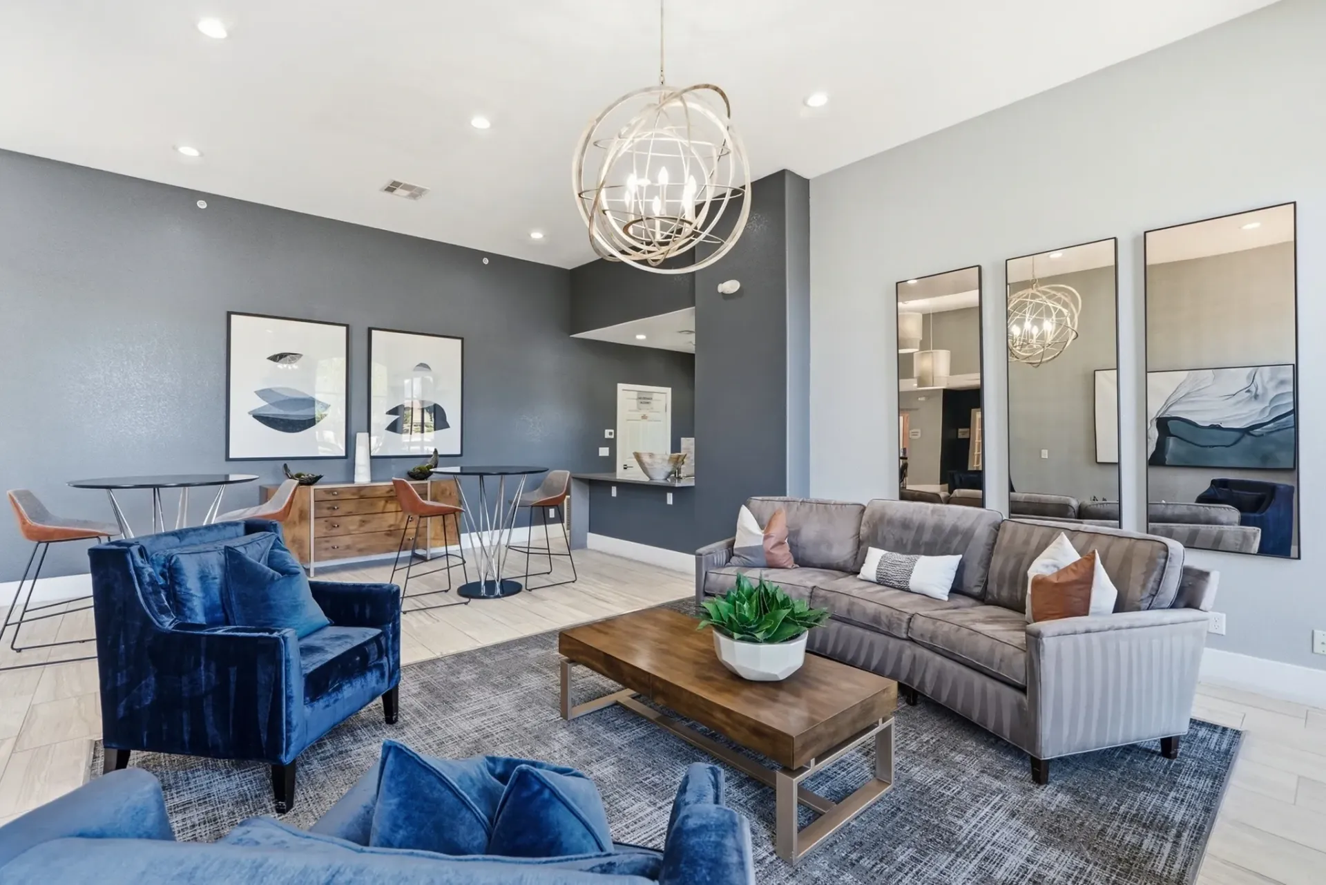 Lounge area with plush seating, coffee table, and bar area.
