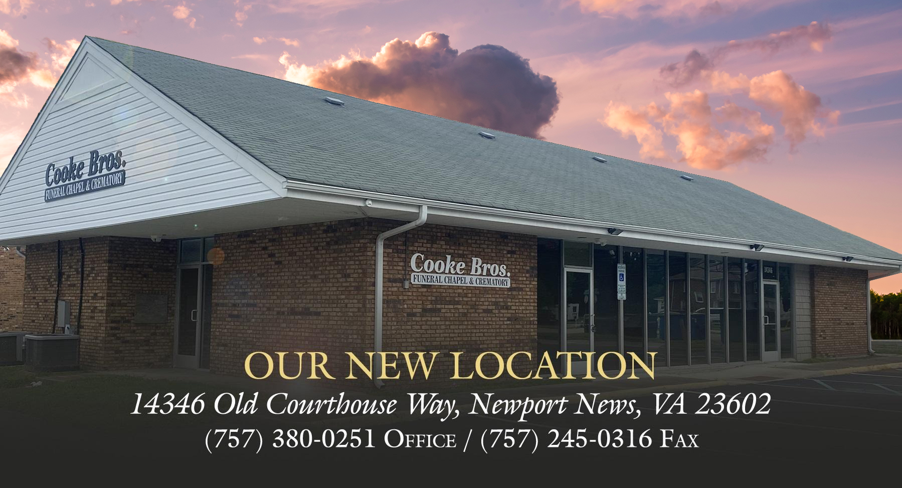 A brick building with a metal roof under a sunset sky, advertising a new location at 14346 Old Courthouse Way, VA.
