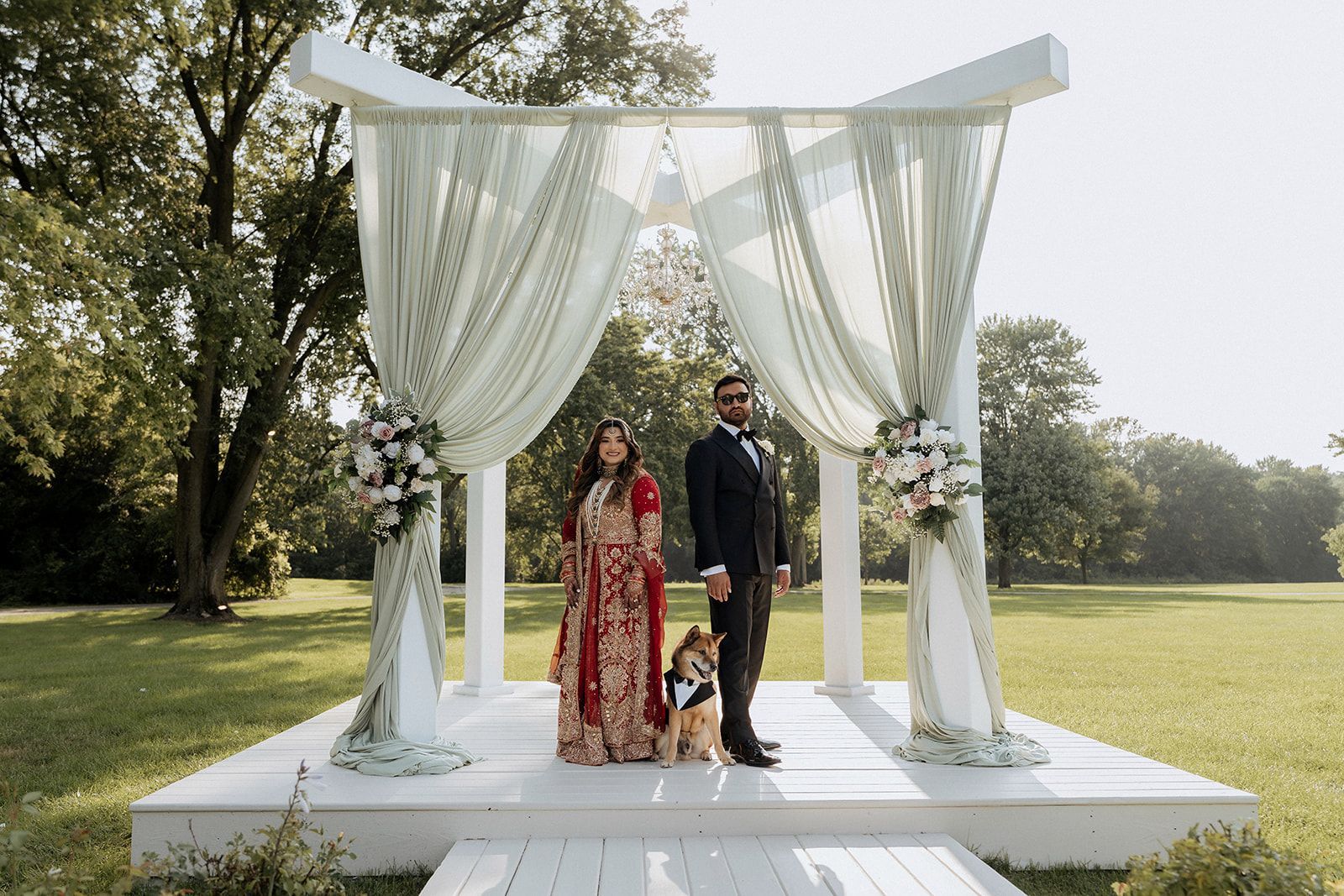 South Asian Wedding Couple standing on Gazebo