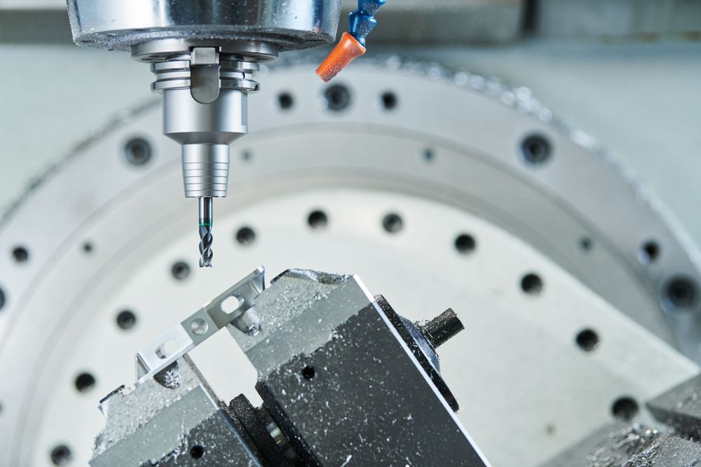 CNC milling machine cutting metal part.
