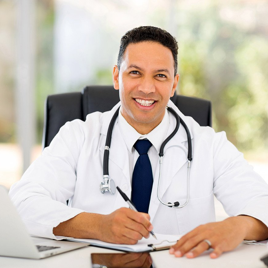 A doctor with a stethoscope around his neck is writing in a notebook