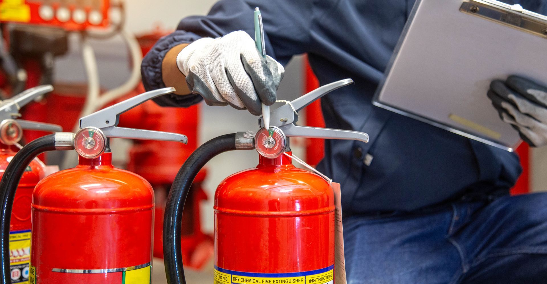 Engineer are checking and inspection a fire extinguishers tank.