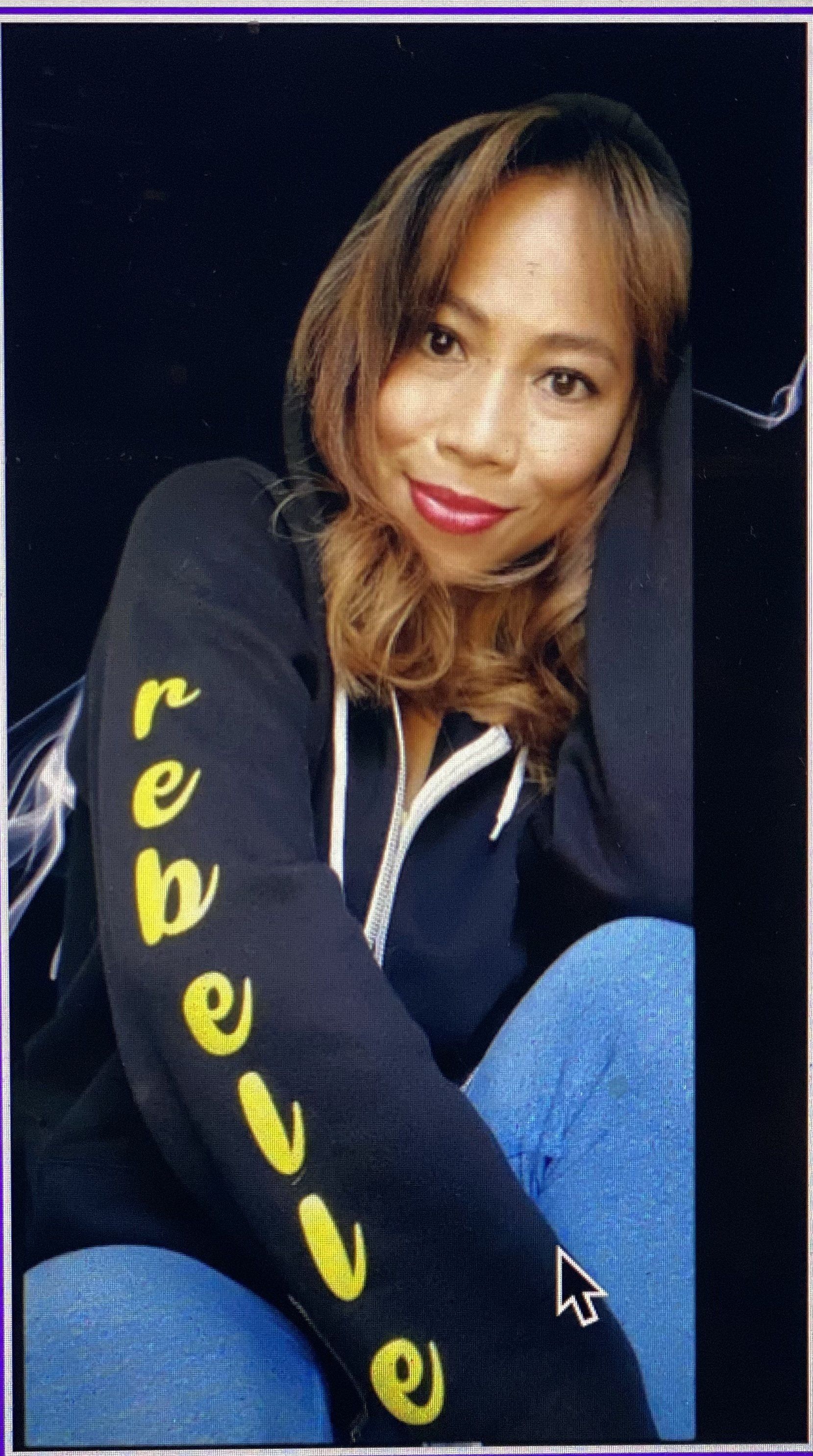 Woman in a black hoodie with
