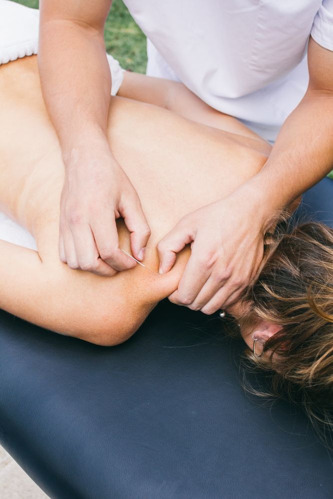 Massage Therapist Giving Shoulder And Neck Massage To A Person — Integrate Health In Ooralea, QLD