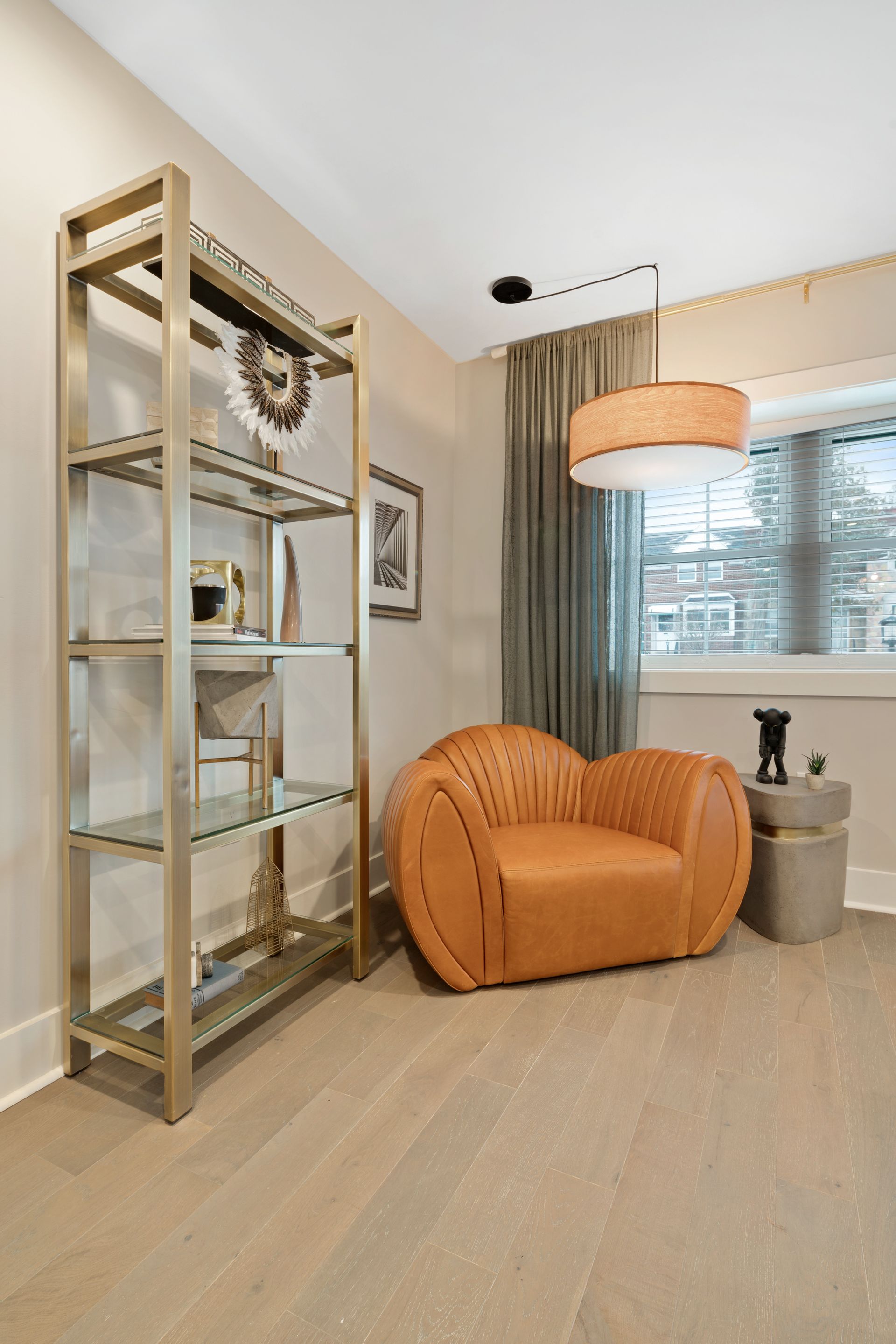 There is a chair and a bookshelf in the room.