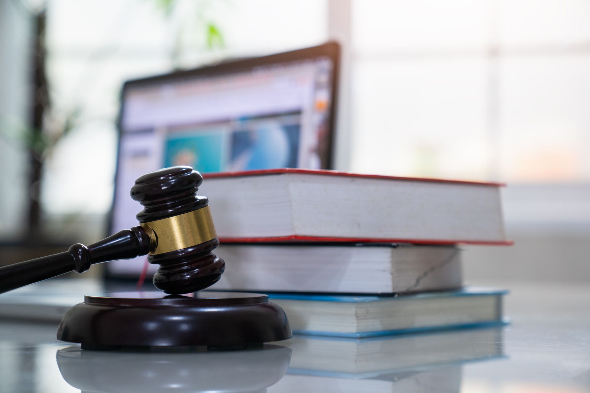 Judge gavel and legal book on wooden table, justice and law concept Judge gavel and legal book on wooden table, justice and law concept