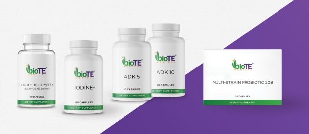 Bottles and a box of Biote supplements on a purple background.