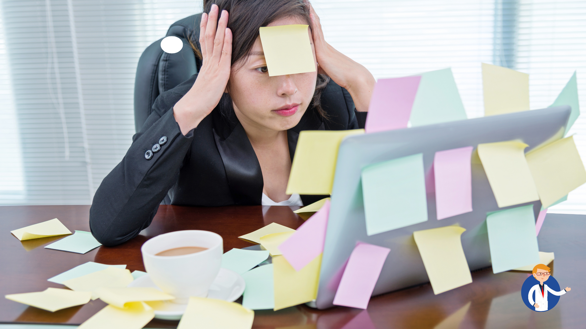 A woman is sitting at a desk with sticky notes on her face.