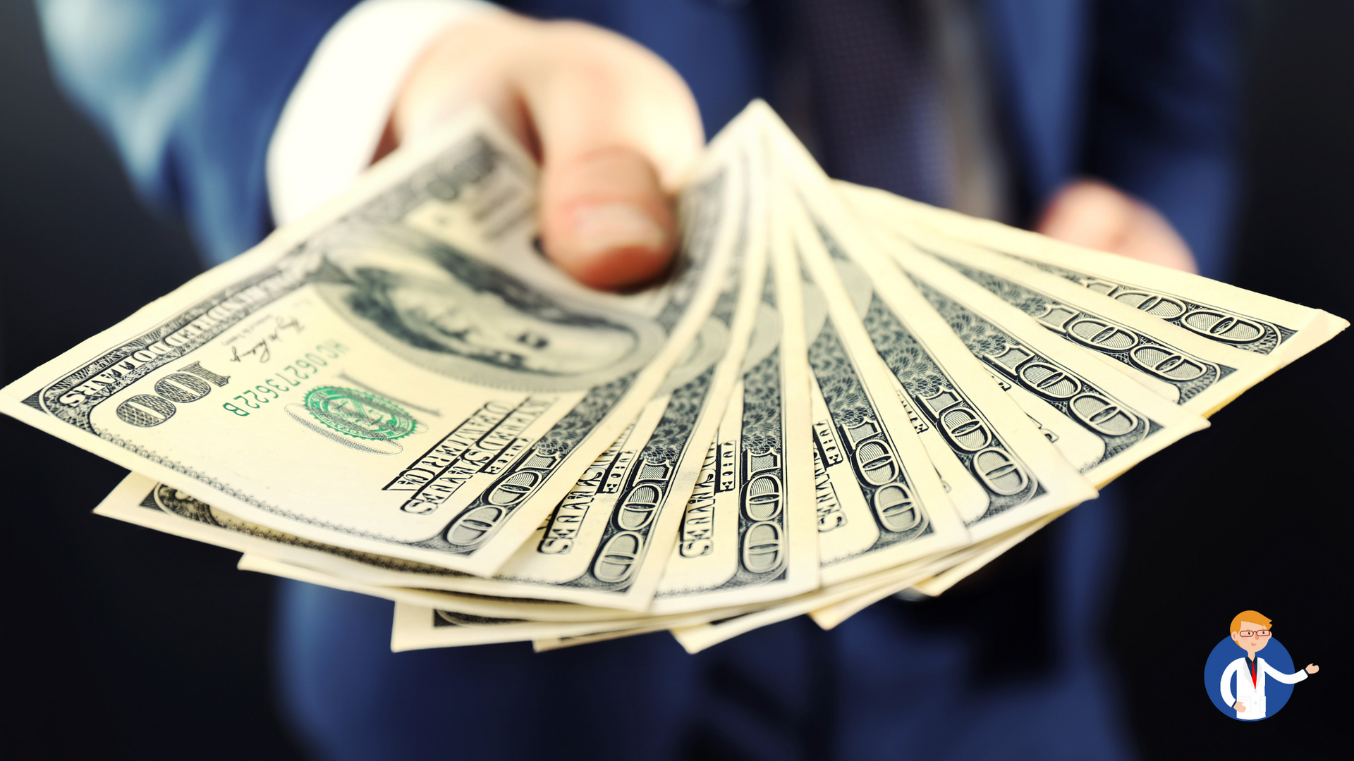 A man in a suit is holding a fan of money