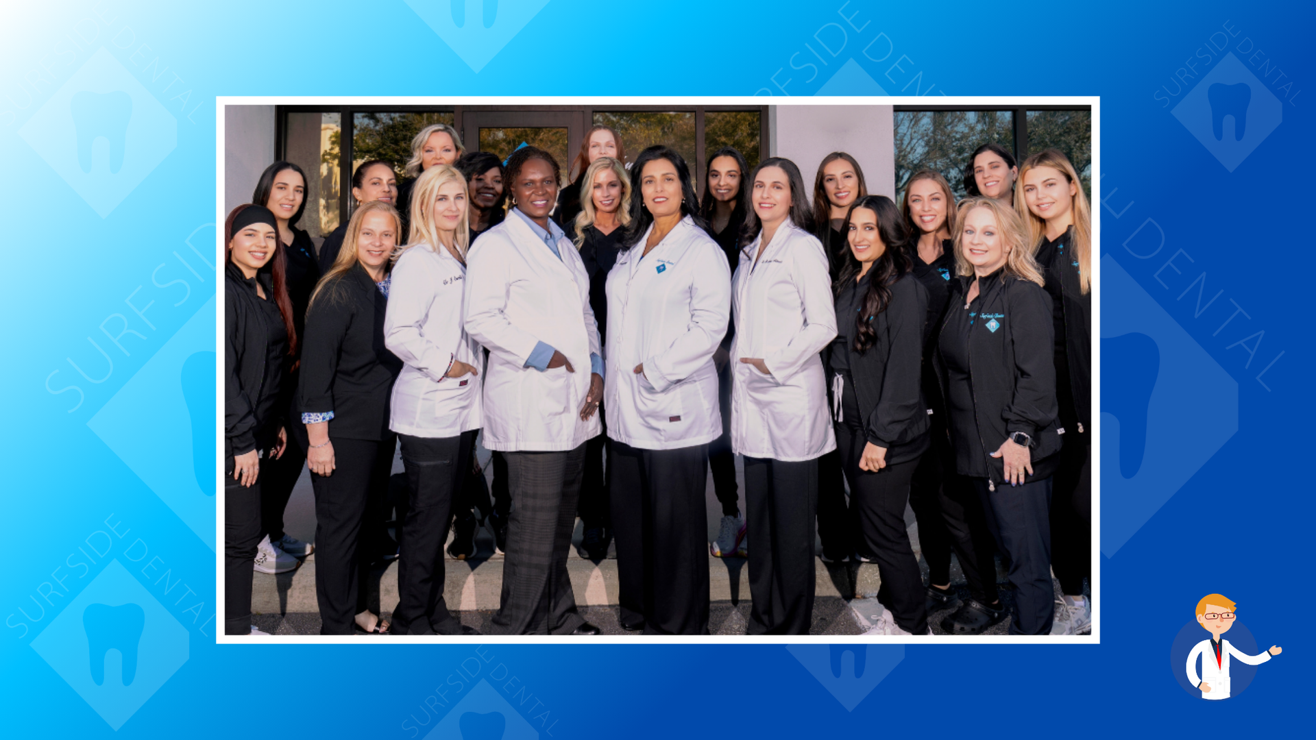 Dental office staff posing together outside. Most are wearing black scrubs, some in white coats.