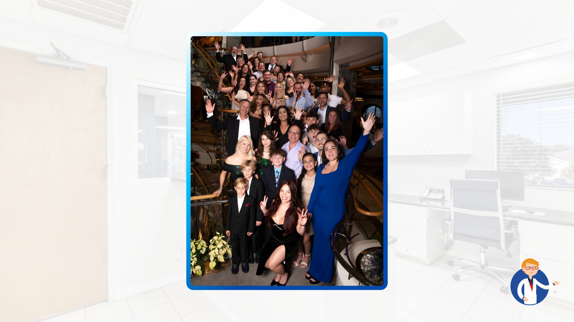 Large group posing on ornate staircase. Woman in blue dress waves, others smile. Formal setting, likely event.