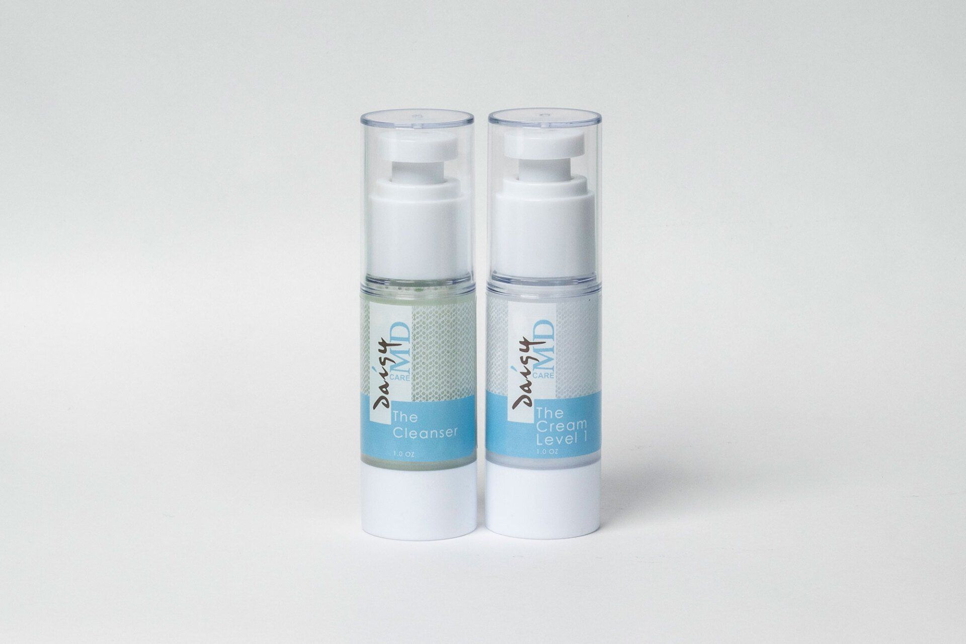 Two stacked skincare bottles with clear pumps and white and blue labels.