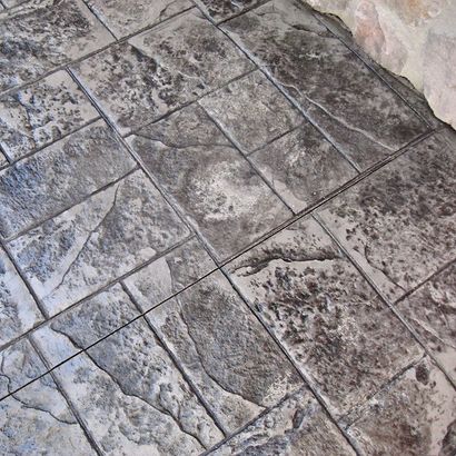 Stone-tiled floor with gray and beige irregular patterned tiles