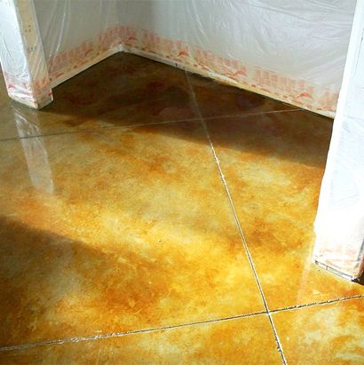 Glossy brown tiled floor corner with white walls and orange-stained plastic sheeting