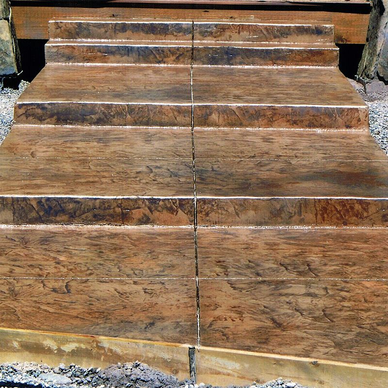 Worn wooden steps with visible grain and a central seam, viewed from the front