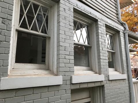 A brick building with a lot of windows on it