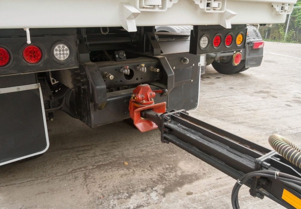 A Truck With A Trailer Attached To It Is Parked In A Parking Lot — Wilson's Towing In Chinchilla, QLD