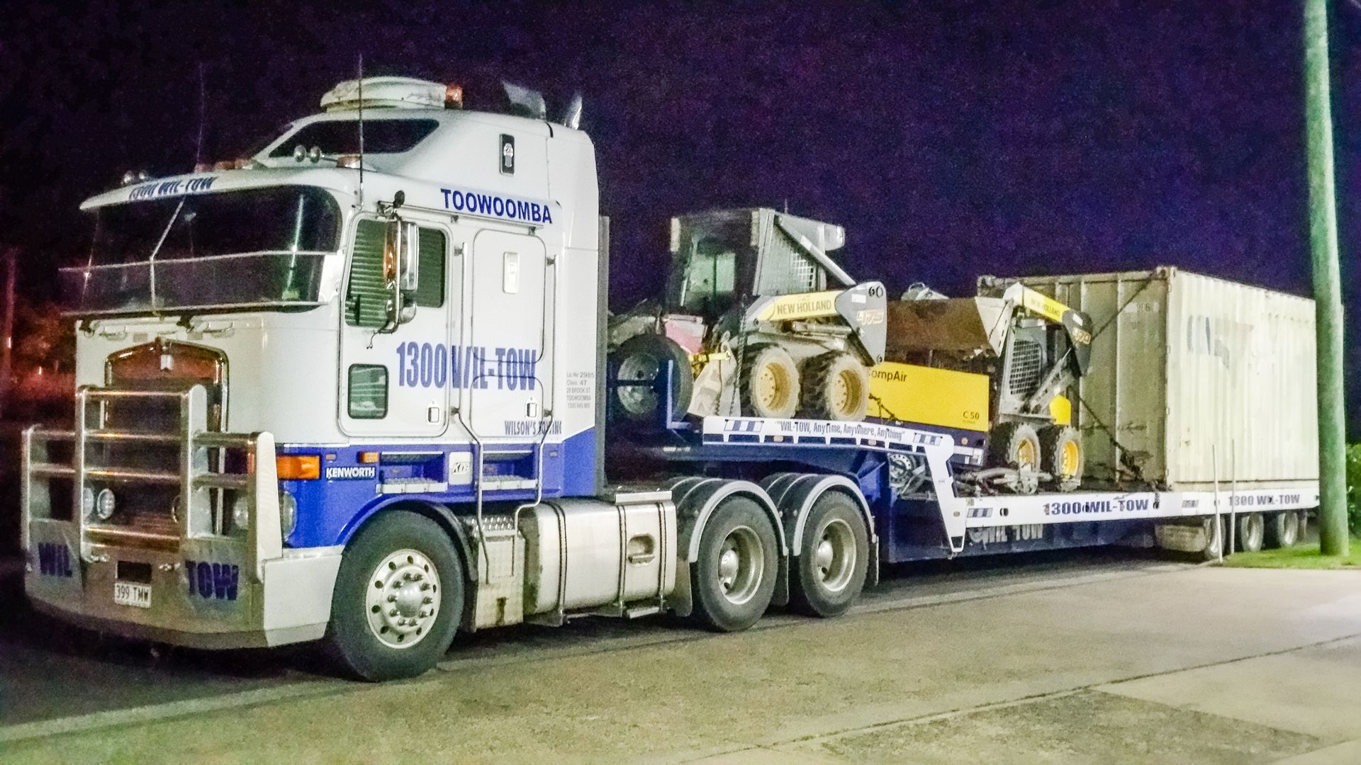 A Tow Truck Pulling A Tractor — Wilson's Towing In North Toowoomba, QLD