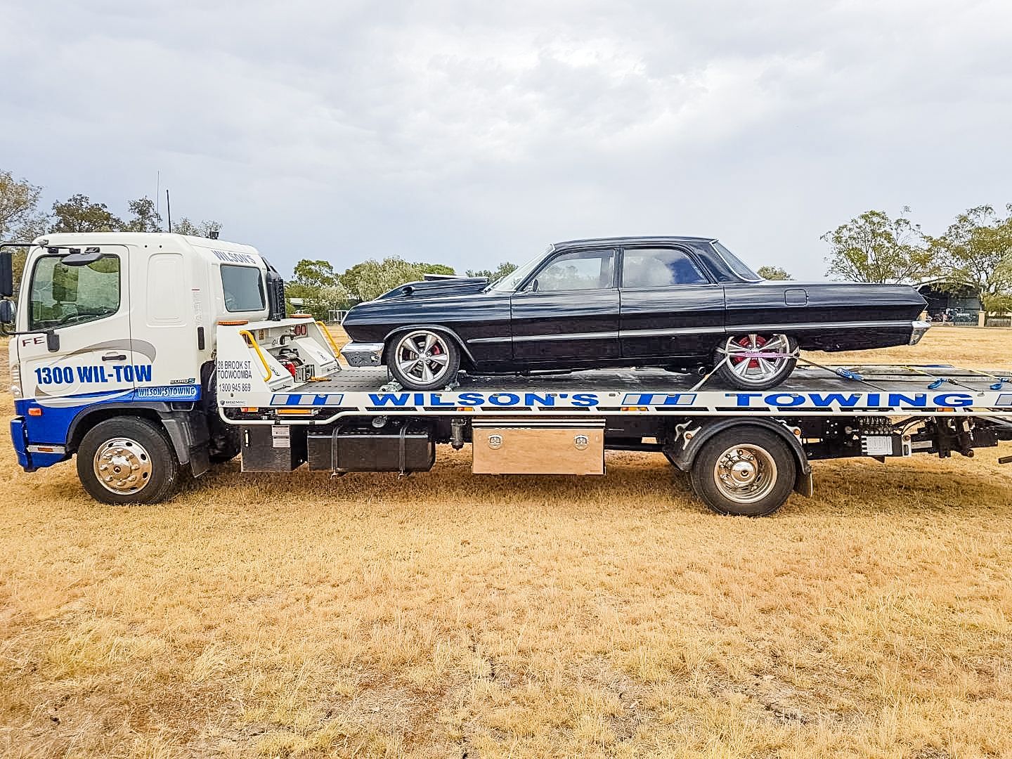 Tow Truck Towing a Car — Wilson's Towing In Pittsworth, QLD