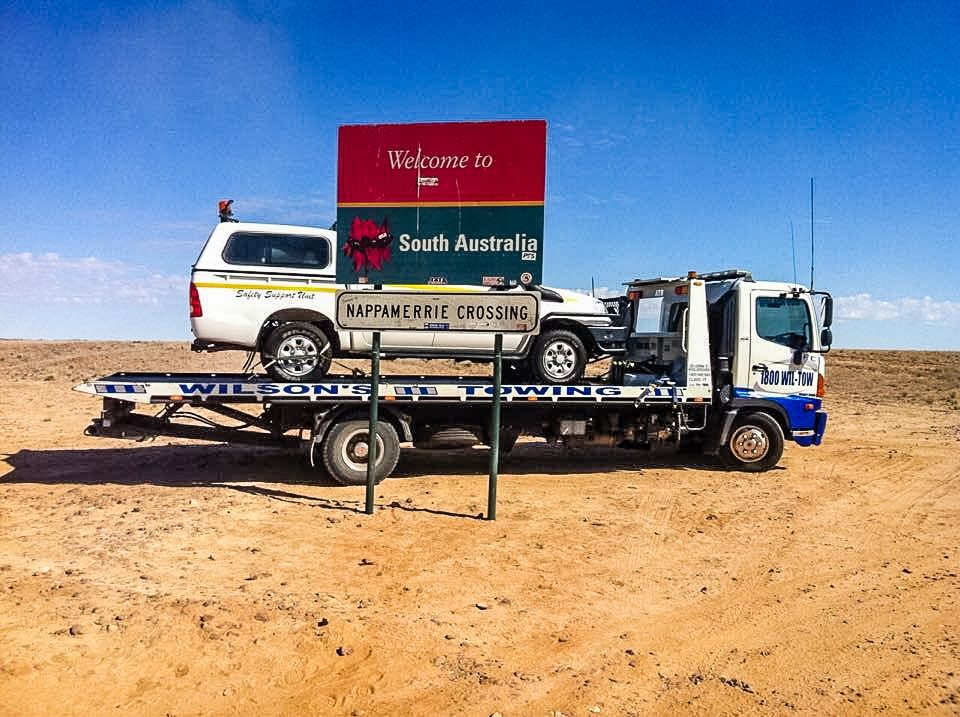 A Dump Truck Is Sitting On Top Of A Trailer — Wilson's Towing In North Toowoomba, QLD