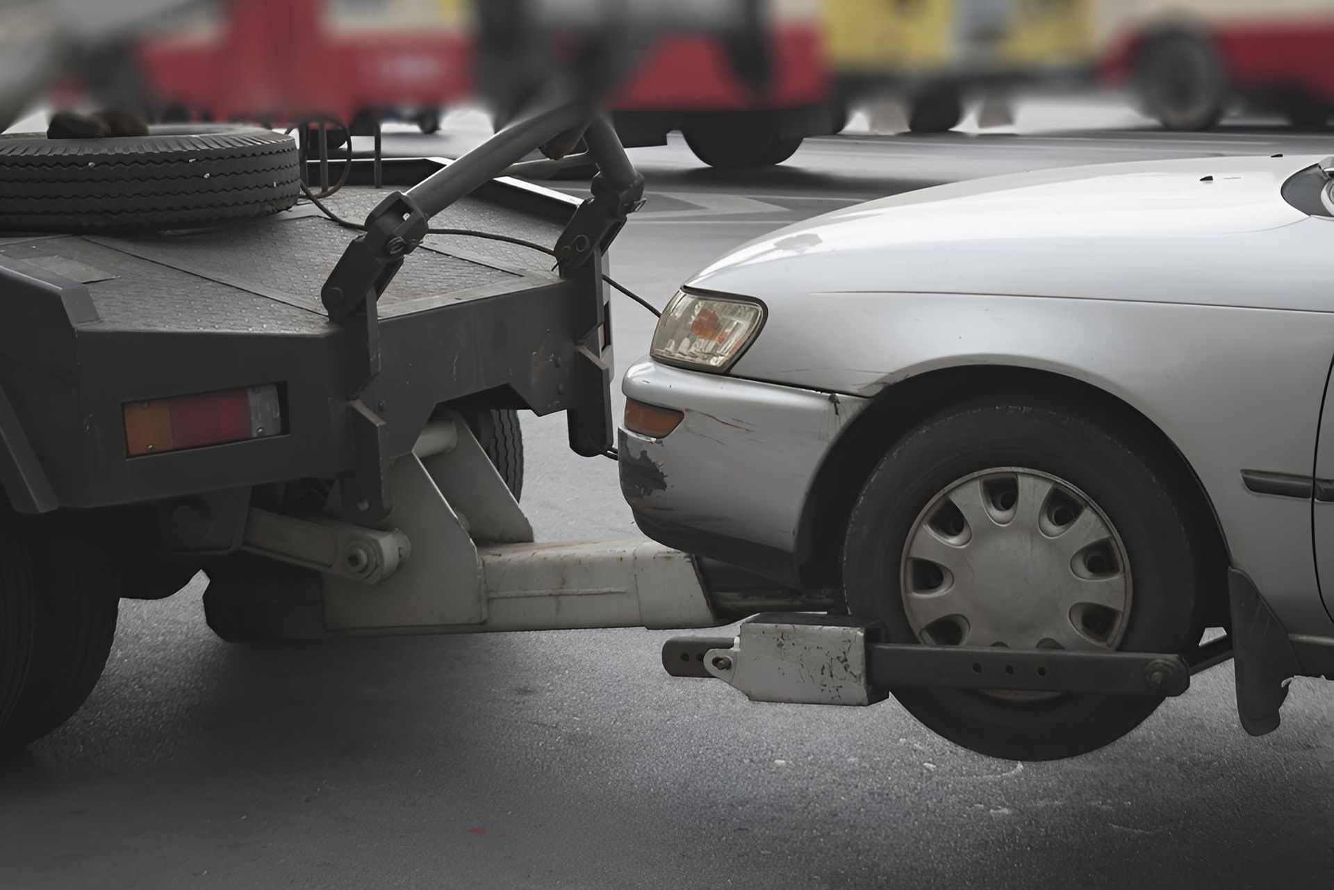A white car is being towed by a tow truck. — Wilson's Towing In Nanango, QLD